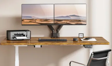Collection of monitor arms mounted on desks in a home office
