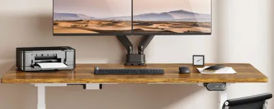 Collection of monitor arms mounted on desks in a home office