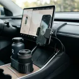 3D printed phone mount and cup holder expander in a modern car interior