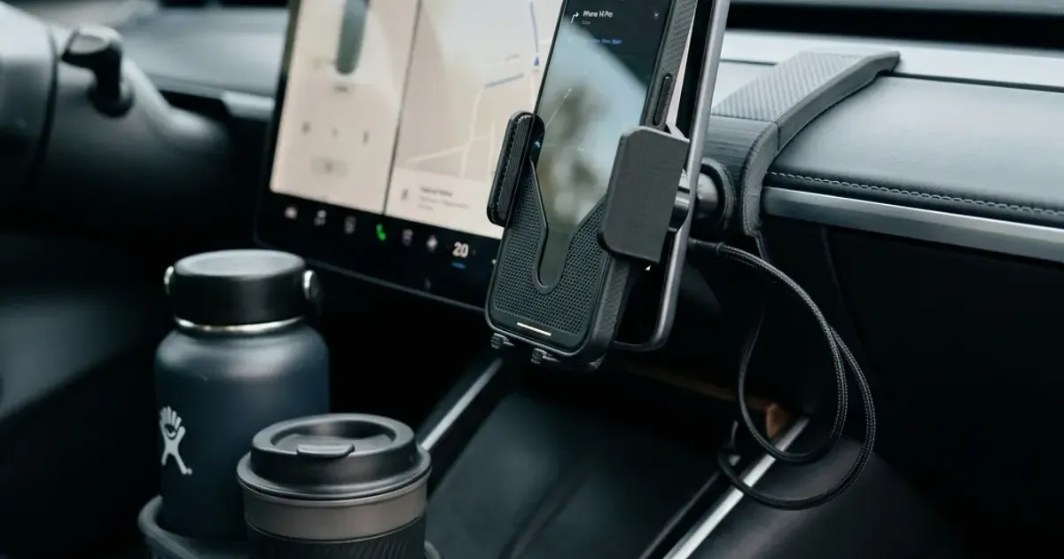 3D printed phone mount and cup holder expander in a modern car interior