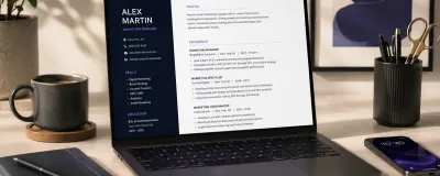 A laptop showing a resume being polished with AI assistance during a job search
