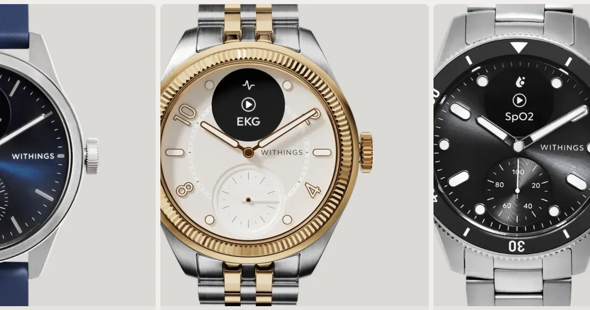 A sleek Withings hybrid smartwatch resting on a wooden desk