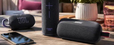 A few portable Bluetooth speakers under $100 on an outdoor table
