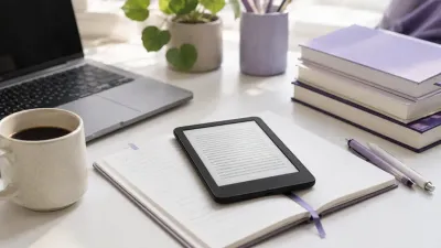 Kindle e-reader on a desk next to textbooks, notebooks, and a coffee cup in a student study setup