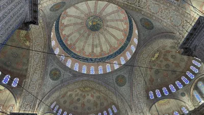 Interior view of the Blue Mosque (Sultan Ahmed Camii) in Istanbul with its iconic blue Iznik tiles and central dome