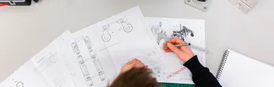 3D printer with cost breakdown elements on a modern desk