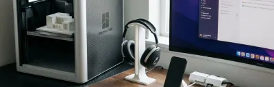 Ten functional 3D printed desk accessories arranged on a clean surface