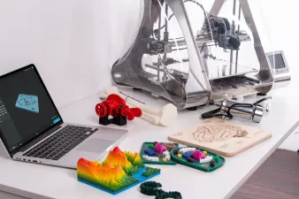 Collection of beginner 3D print projects arranged on a clean background