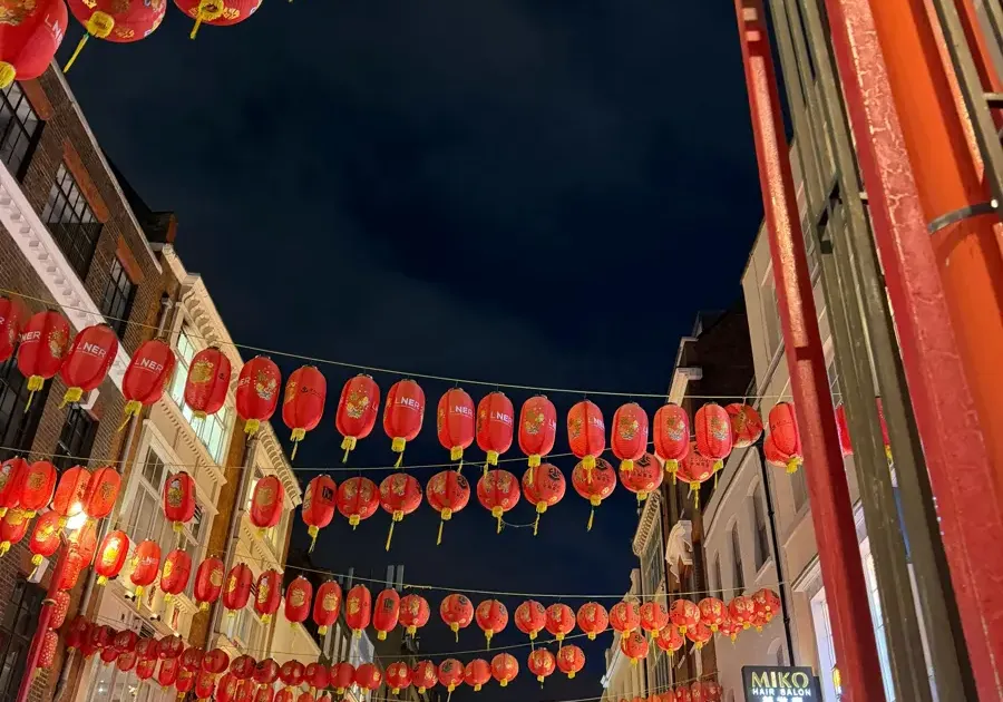 AI-planned London trip scene with Chinatown and city landmarks