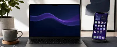 A clean, organized laptop desktop next to a tidy phone home screen