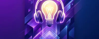 A sleek workstation with headphones and a glowing lightbulb icon, representing inspiration.