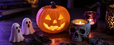 A collection of 3D printed Halloween decorations including pumpkins, ghosts, and lanterns