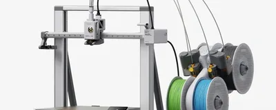 The Bambu Lab A2L 3D printer showing its large 330mm build plate and linear motor rails.