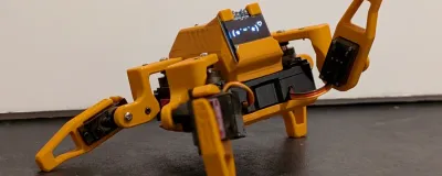 Sesame Robot 3D printed quadruped with OLED eyes on a desk