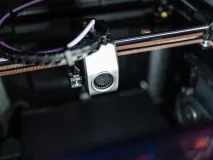 Common 3D printing mistakes illustrated with failed prints on a build plate