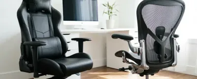 Side-by-side comparison of Secretlab Titan Evo and Herman Miller Aeron chairs