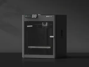 Beginner-friendly 3D printer on a desk with a freshly printed object