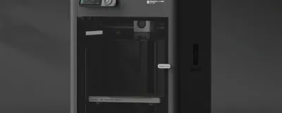 Beginner-friendly 3D printer on a desk with a freshly printed object
