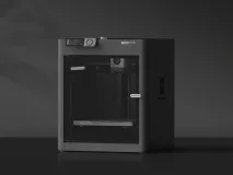 Beginner-friendly 3D printer on a desk with a freshly printed object