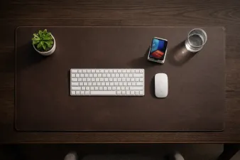 Collection of desk mats and pads in different materials on a desk