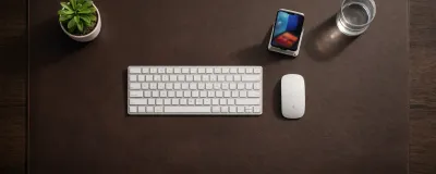 Collection of desk mats and pads in different materials on a desk