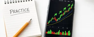 Collection of paper trading app interfaces on a phone and laptop