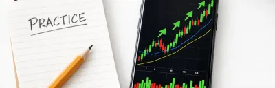 Collection of paper trading app interfaces on a phone and laptop