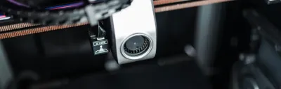 Common 3D printing mistakes illustrated with failed prints on a build plate