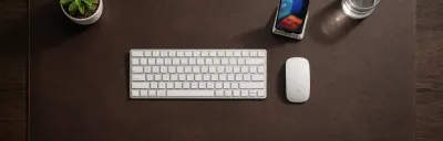 Collection of desk mats and pads in different materials on a desk