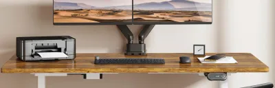 Collection of monitor arms mounted on desks in a home office