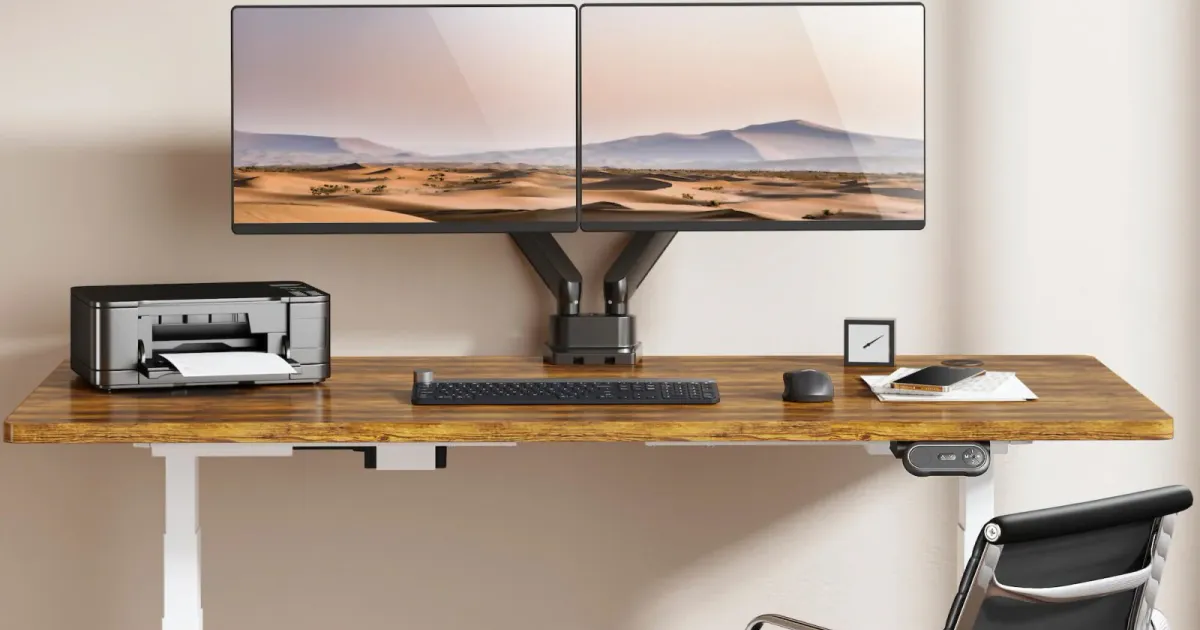 Collection of monitor arms mounted on desks in a home office