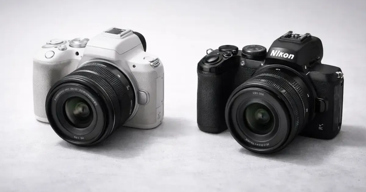 Side-by-side comparison of Canon EOS R100 and Nikon Z50 II cameras