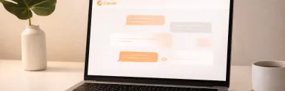 Claude AI interface on a laptop in a modern workspace
