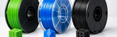 Side-by-side comparison of PLA, PETG, and ABS 3D printing filaments