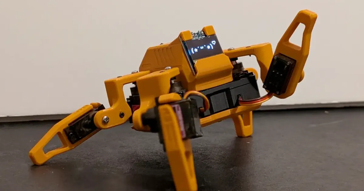 Sesame Robot 3D printed quadruped with OLED eyes on a desk
