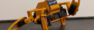 Sesame Robot 3D printed quadruped with OLED eyes on a desk